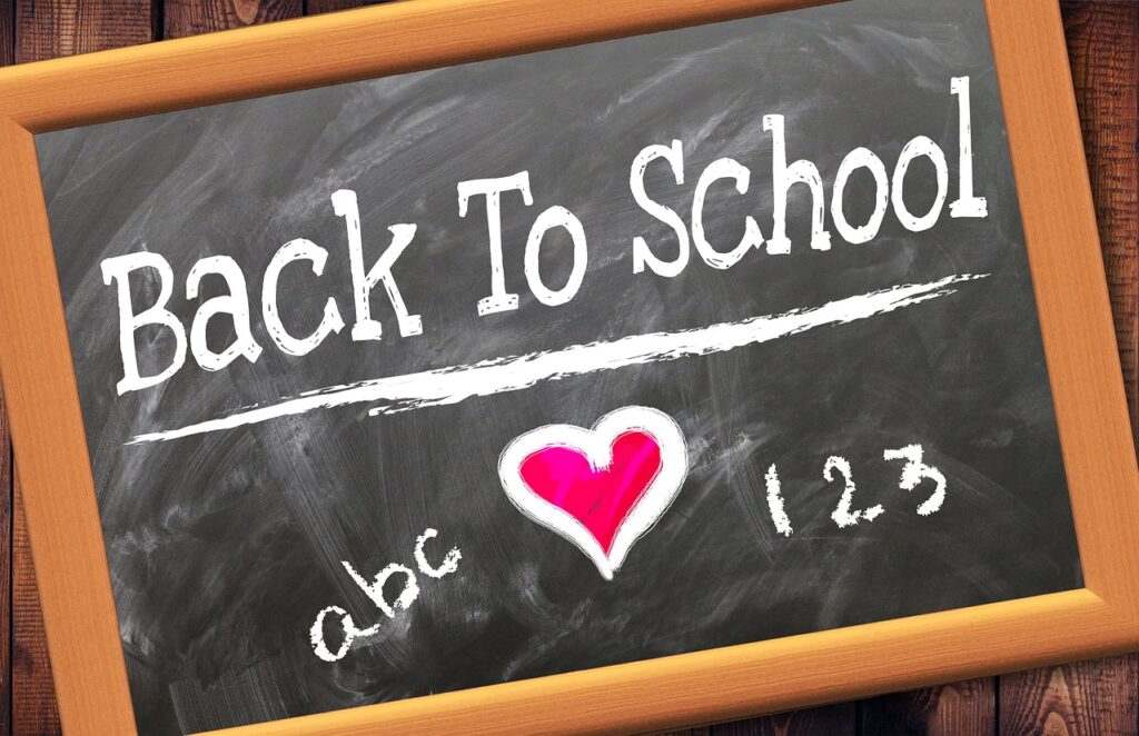 Chalk board with Back to School written with pink heart